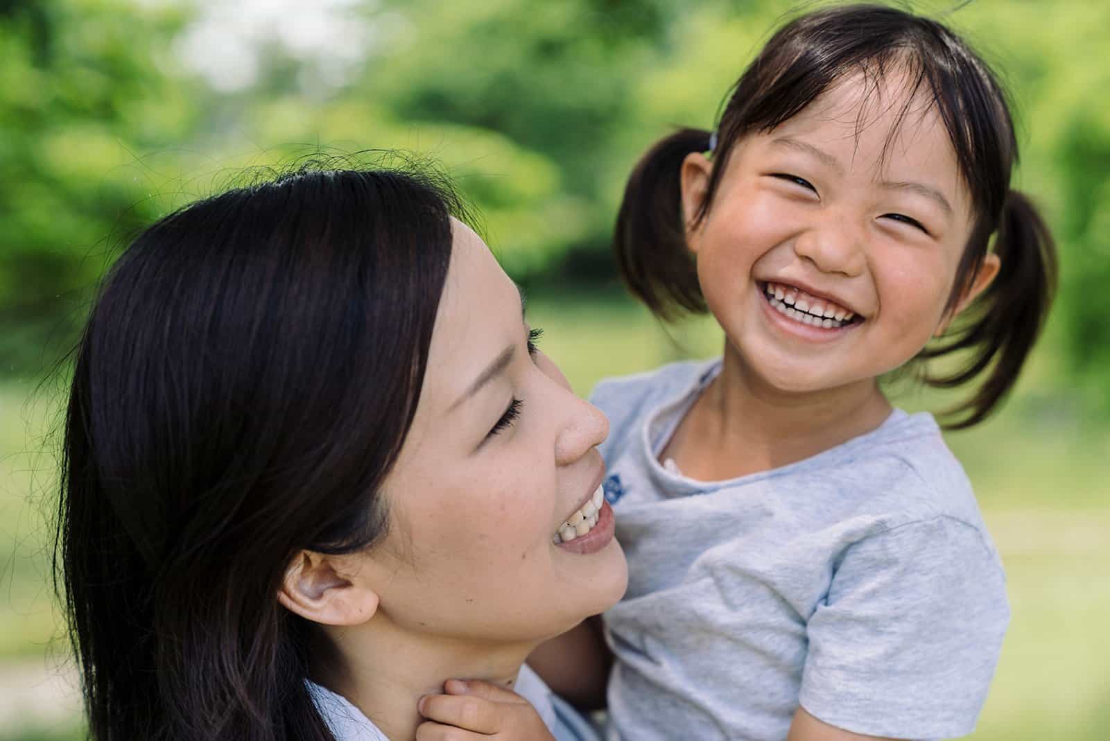 Happy mother and child laughing